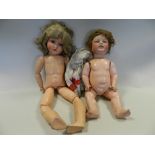 An Armand Marseille 'Trembling tongue' doll together with another German bisque headed doll by H W