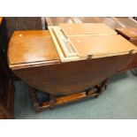 A 1920s/30s oval oak dining table on barley twist legs in Carolean style and a triple dressing