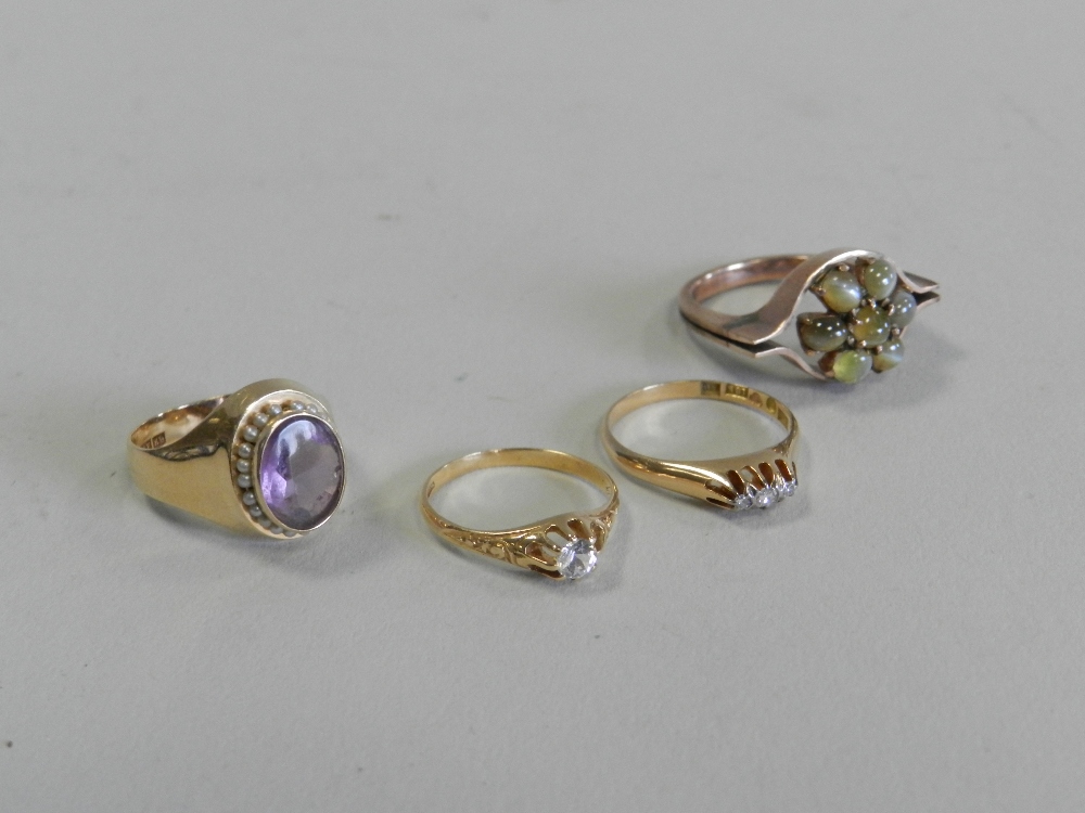 A cat's eye cluster ring together with an amethyst and seed pearl cluster ring,