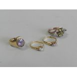 A cat's eye cluster ring together with an amethyst and seed pearl cluster ring,