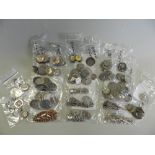 A collection of silver alberts and fobs,