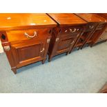 A pair of Empire style mahogany bedside cabinets each with drawer and cupboard door below ,