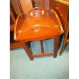 A Far Eastern hardwood folding butler's tray on stand