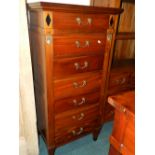 An Empire style mahogany semainier with seven short drawers 62cm wide, 47cm deep,