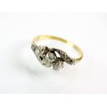 A three stone diamond crossover ring,