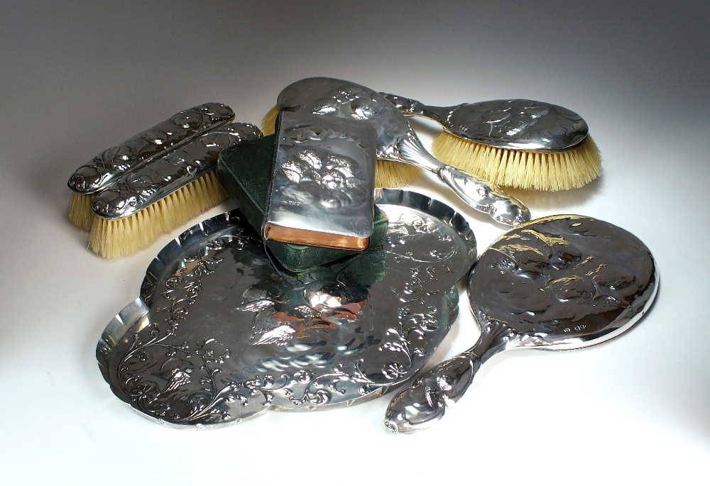 A silver mounted dressing table set, William Comyns & Sons, London 1896, 1900 and 1905,