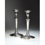 A pair of silver candlesticks, James Dixon & Sons Ltd, Sheffield date mark rubbed,