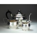 A matched three piece silver tea service, comprising; a teapot, George Burrows I, London 1801, 16.