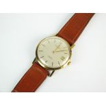 A Gentleman's 9ct gold Accurist automatic shockmaster wristwatch, the silver dial with batons,