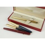 A collection of twenty-one fountain pens and a pen/pencil set,