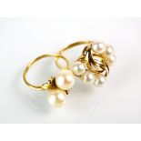 A cultured pearl crossover ring, the yellow metal shank stamped 'K18', size M,