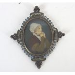 Continental school, late 19th century Portrait miniature of a lady in medieval costume,