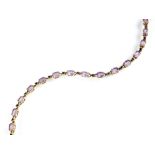 A 9ct gold amethyst and sapphire bracelet, designed as sixteen oval mixed cut amethysts,