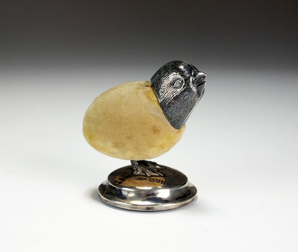 An Edwardian novelty silver mounted pin cushion in the form of a chick, Henry Williamson Ltd,