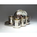 A set of four French silver cups and saucers,