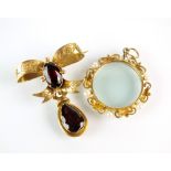 A late 19th century garnet set brooch,