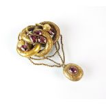 A 19th century garnet set locket brooch,