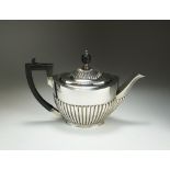An Edwardian silver teapot, makers mark rubbed, London 1901,