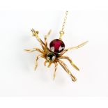 An early 20th century ruby and peridot spider brooch,