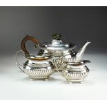 A Victorian three piece silver tea service, Walter & John Barnard, London 1894 & 1895,