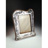 An Art Nouveau silver mounted photograph frame, James Deakin & Sons, Chester 1905,