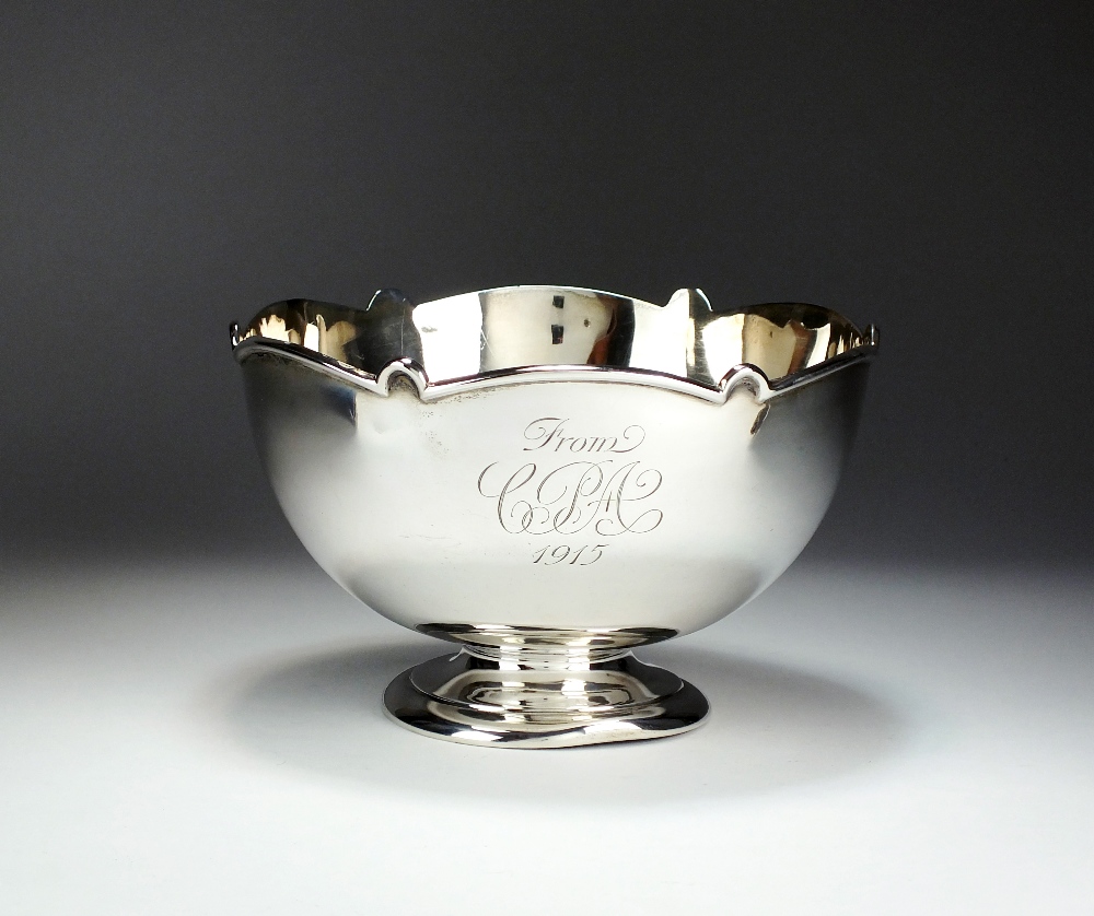 A silver pedestal monteith style bowl, makers mark rubbed, London 1914,