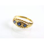 An early 20th century 18ct gold seven stone sapphire and diamond ring, hallmarked Birmingham 1916,