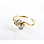 A two stone diamond crossover ring,