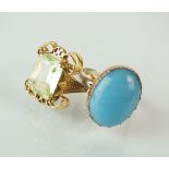 An oval cabochon turquoise ring, claw set within yellow metal to later white metal shank,