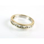 An 18ct white gold diamond set half hoop eternity ring,