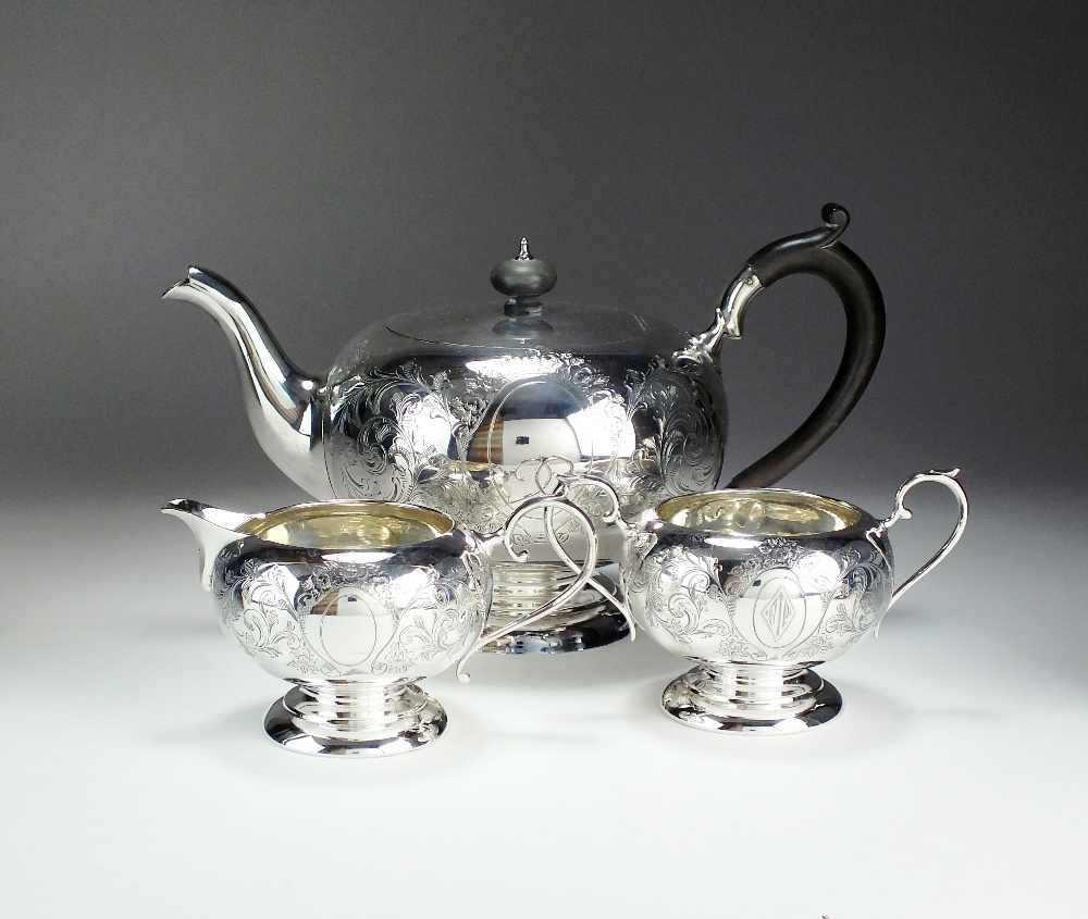 A three piece silver tea service, Cooper Brothers & Sons Ltd, Sheffield 1916 & 1917,