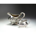 A George IV Irish silver cream jug, makers mark rubbed, Dublin 1828,