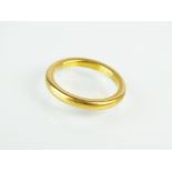 A 22ct yellow gold plain polished wedding band, ring size M, weight 5.