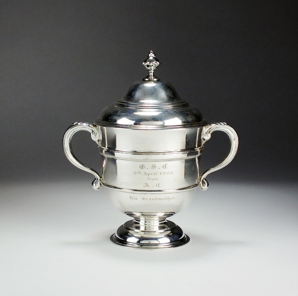 A two handled silver trophy cup and cover, Mappin & Webb, London 1913,