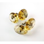 A pair of oval faceted citrine cufflinks,