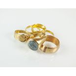 Two 22ct gold wedding bands, together with an 18ct gold wedding band, a 9ct gold band,