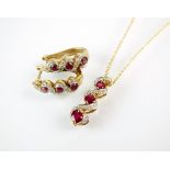 A 9ct gold ruby and diamond cluster pendant on chain,