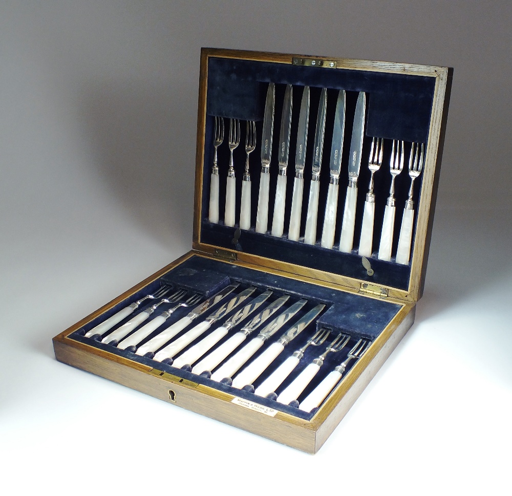 A cased set of twenty-four silver fruit knives and forks, Mappin & Webb, Sheffield 1918,