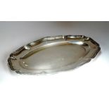 A French silver oval platter, with reeded lobed rim and engraved initials, 45cm wide, weight 38.