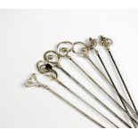 A collection of seven Charles Horner silver hat pins,