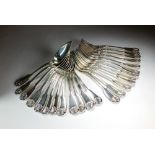 A set of twenty-four mid-19th century French silver Shell and Fiddle pattern spoons and forks,