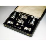 A cased set of six silver cruets, Henry Clifford Davis, Birmingham 1920, comprising; two mustards,