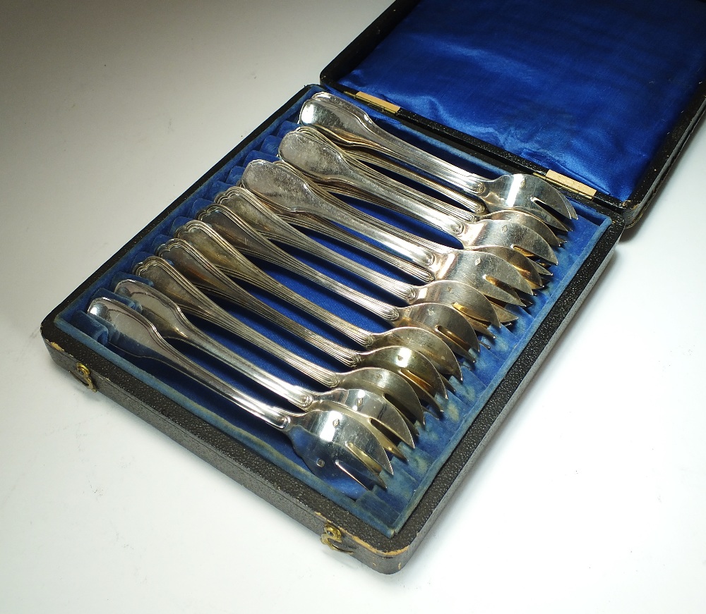 A collection of French silver oyster forks,