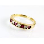 An 18ct gold seven stone ruby and diamond ring,