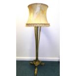 An Adam revival brass telescopic standard lamp with tasseled shade on an open column stand with