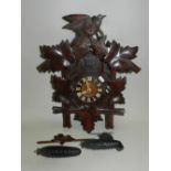 An Austrian carved wood weight driven cuckoo clock