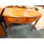 A George III style crossbanded mahogany finish bow front side table with two frieze drawers on