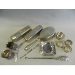 Two silver handled button hooks together with a pair of silver salts, silver napkin rings,