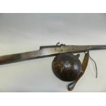 A Middle Eastern muzzle loading rifle together with leather bound saddle flask from the same region