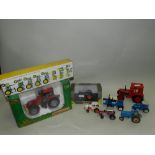 A group of boxed and unboxed die-cast model tractors by Universal Hobbies,